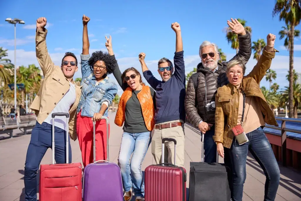 Reasons to book your trip | Group of middle aged excited friends posing